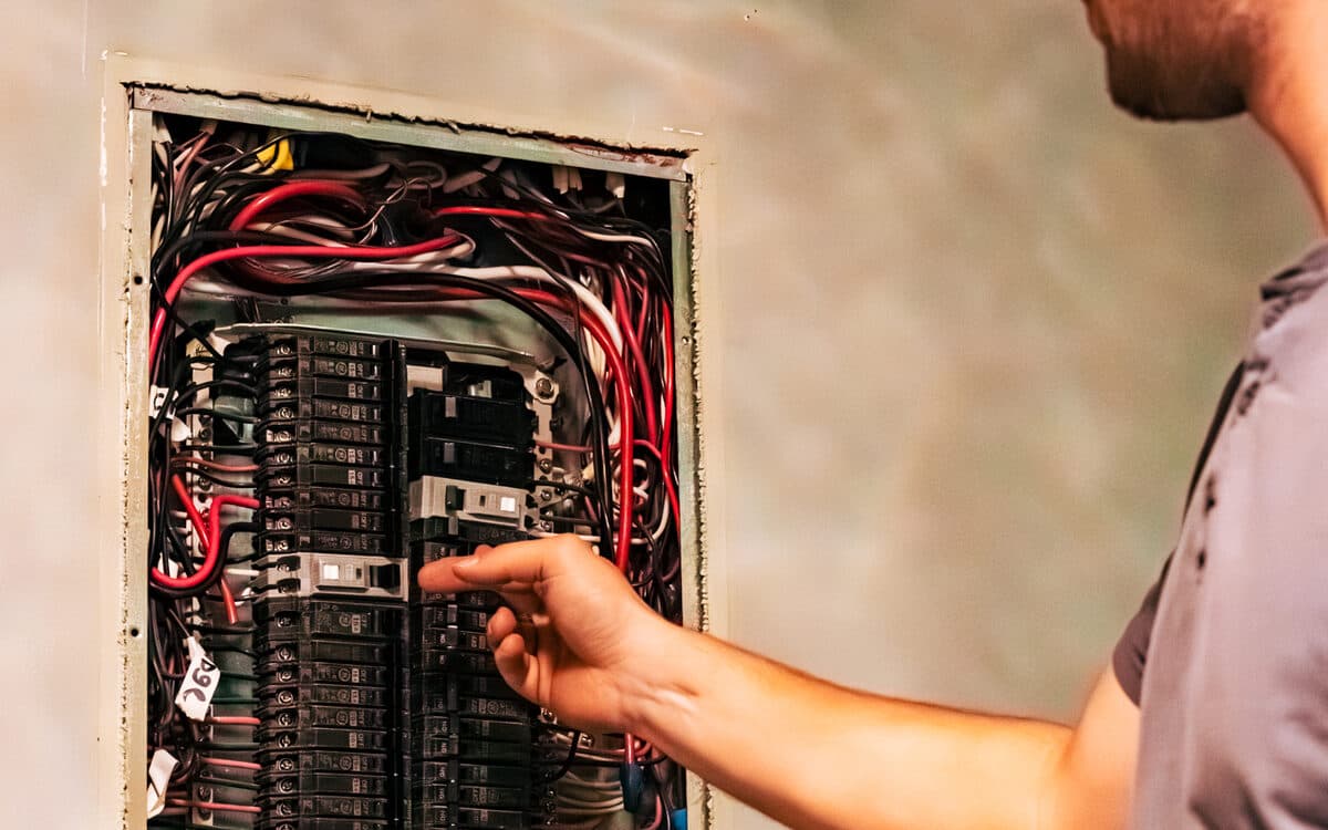 Technician wiring the panel for a furnace install — Furnace Installation completed in Langley, BC by DirectBuy Furnace