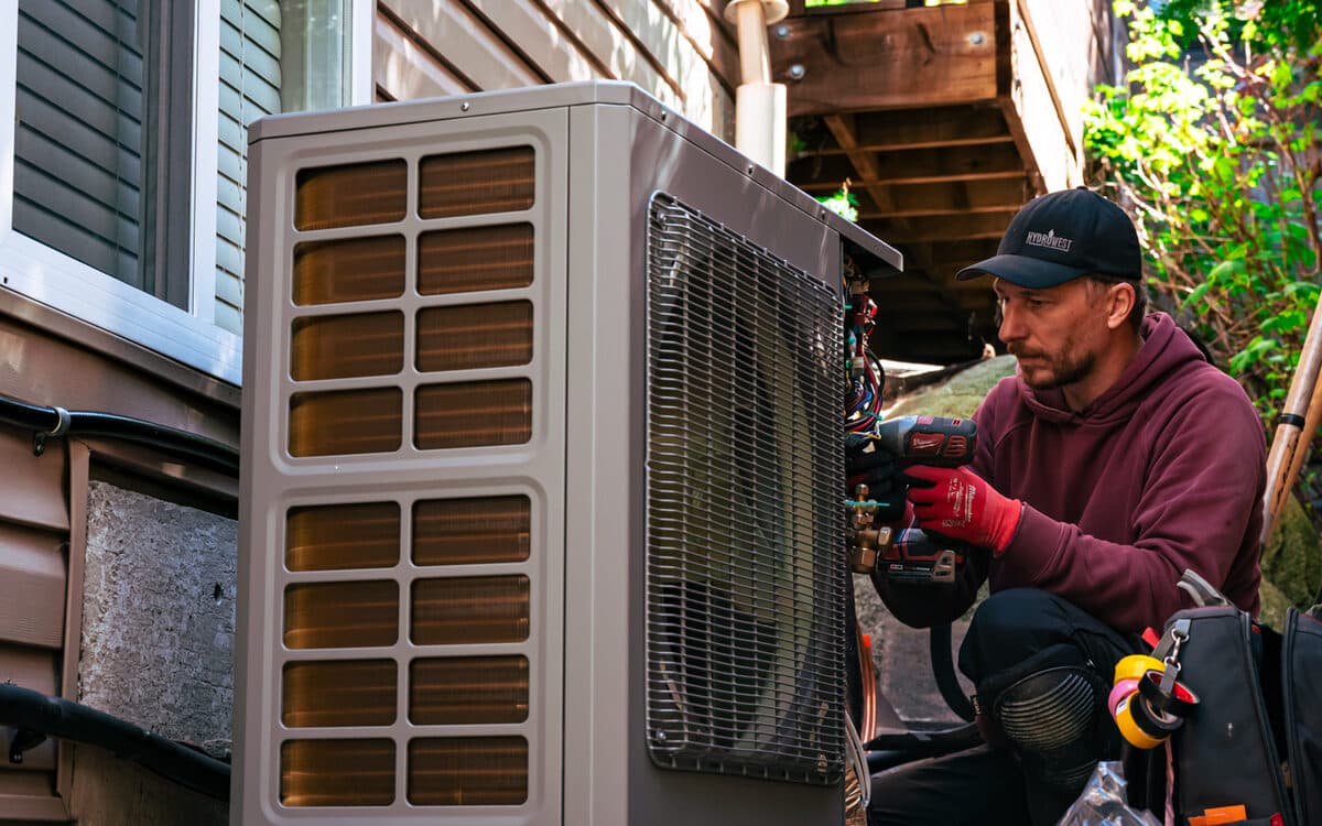 Wall-mounted outdoor cooling unit — AC Installation completed in Abbotsford, BC by DirectBuy Furnace
